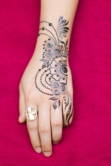Realism tattoo artist preparing reference and stencil